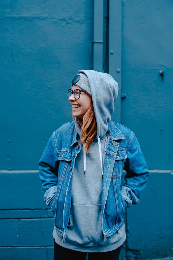 Student smiling in hoodie